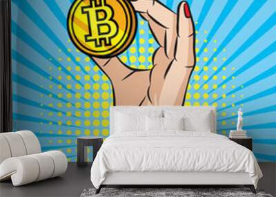 Vector retro illustration  pop art comic style of  a woman's hand holding a golden coin. A Vintage poster of a  bitcoin in girl's hand over halftone dot background. Wall mural