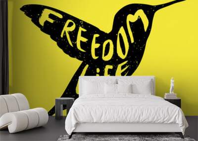 Hummingbird vector icon. Bird simple isolated sign silhouette with text Freedom life. Wall mural