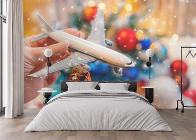 Beautiful christmas background with airplane. Travel concept for christmas and new year. Selective focus. Wall mural