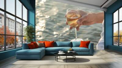 Drink wine by the sea. Selective focus. Wall mural