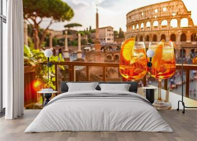 Two glasses of Aperol against the backdrop of Italy. Selective focus. Wall mural