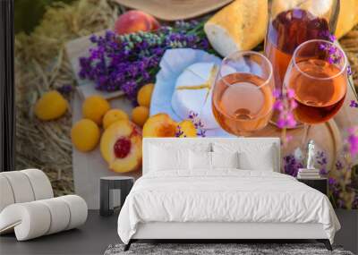 Wine in glasses. Picnic in the lavender field. Selective focus. Wall mural