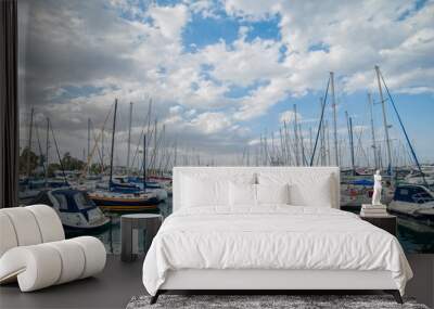 yachts standing in two rows with the reflection in the sea in a Wall mural