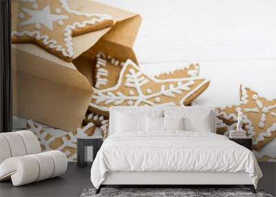 Gingerbread cookies in a packing pag on a white wooden backgroun Wall mural