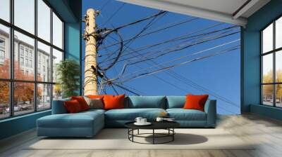 Power pole with intertwined wires Wall mural