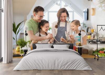 Family cooking in the kitchen at home Wall mural