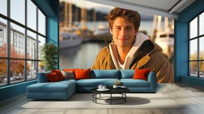 Portrait of a handsome young man in a boat marina. Wall mural