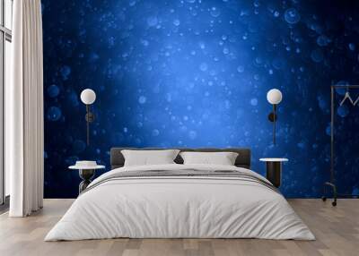 Blue bokeh dark background. Bubbles under the ocean With copy space Wall mural