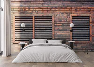 A brick wall with two air condition vents Wall mural