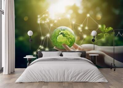 hand holding green earth Wall mural