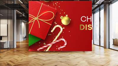 Festive banner for Christmas sale. Holiday background with realistic red and green gift boxes, candy canes, Christmas balls, golden confetti and snowflake. Vector illustration. Xmas promo header. Wall mural