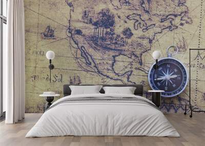 Classic round compass on old vintage map depicting North America and the United States of America as symbol of tourism with compass, travel with compass and outdoor activities with compass Wall mural