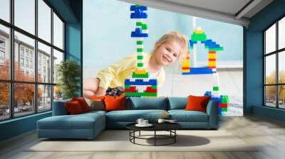 the girl built a tower of cubes. The joy of games Wall mural