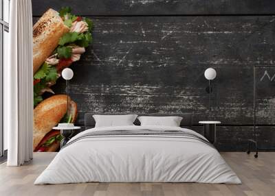 Two tuna sandwich on dark wood background Wall mural