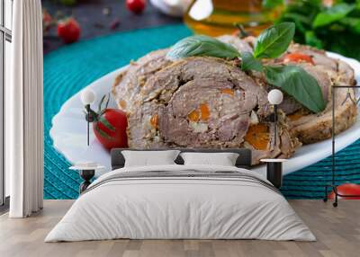 Delicious meat rolls stuffed with vegetables with cherry tomatoes and basil. Festive dish. Wall mural