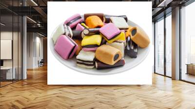 Sweet licorice candy on a plate isolated on white background. Traditional Finnish sweets. Wall mural