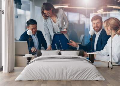 A group of business people partners during a set team meeting in the modern office. Teamwork concept Wall mural