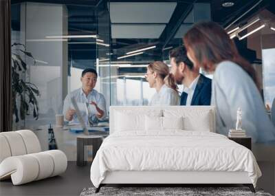 Confident and successful team. Group of people are working together in office. Business concept Wall mural