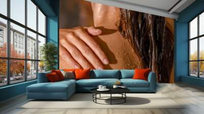 Young woman taking care of her skin while taking shower in the evening. Spa, beauty and care concept Wall mural