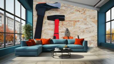 Ax hammer. Tools for working with wood. Tools on wood background. Wall mural