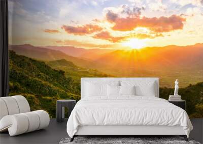 green highland mountain landscape of beutiful sunset or sunrise in greeen summer rural land Wall mural