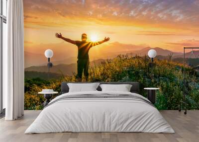 man doing hiking sport in mountains with anazing highland view Wall mural