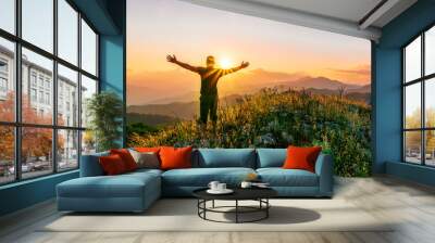 man doing hiking sport in mountains with anazing highland view Wall mural