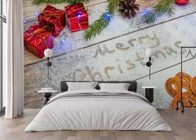 Christmas or New year background concept with blue garland. Flour text and festive Christmas decoration on the table, cookies, bowl of flour. Wall mural