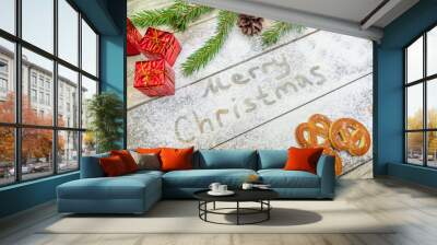 Christmas or new year background concept. Flour text and festive Christmas decoration on the table, cookies, bowl of flour Wall mural