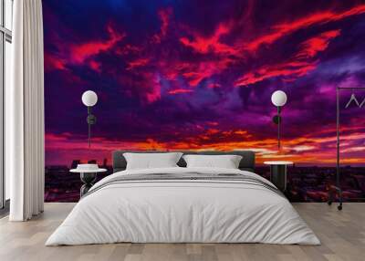 vibrant sunset colors illuminating dramatic skyline bold clouds silhouetted structures exuding captivating urban atmosphere, cityscape, horizon, light Wall mural