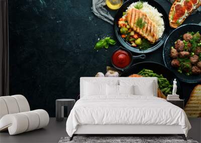 A set of dishes. Fish steak, chicken fillet, meat balls. Flat lay. Top view. Free copy space. Wall mural