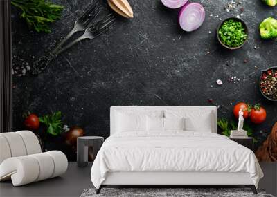 Black food background. Vegetables and spices on black background. Top view. Free space for your text. Wall mural