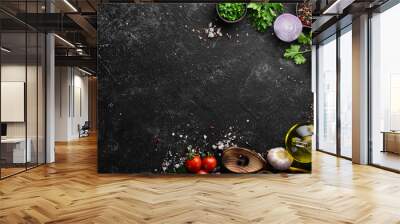 Black food background. Vegetables and spices on black background. Top view. Free space for your text. Wall mural