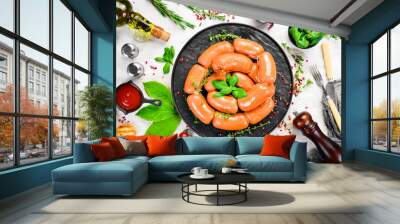 Boiled pork sausages with rosemary and spices. Top view. Rustic style. Wall mural