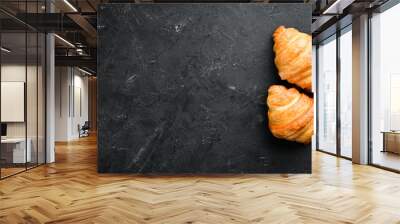 Croissants on a black background. Top view. Free space for your text. Wall mural