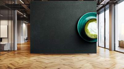 cup of delicious matcha latte on light gray background, closeup. Top view. Wall mural