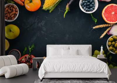 Food. Vegetables, fruits, nuts and berries. Healthy food. On the stone table. Top view. Free space for text. Wall mural