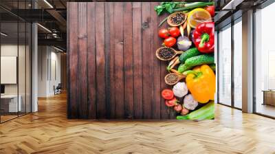 Frame of organic food. Fresh raw vegetables and spices. On a wooden chalkboard. Wall mural