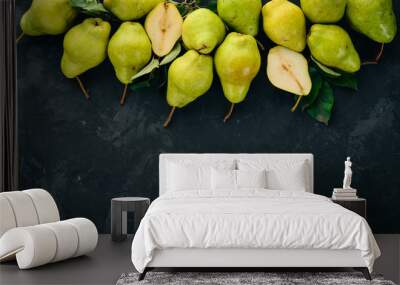 Fresh pears on a black stone table. Fruits. Free space for text. Top view. Wall mural