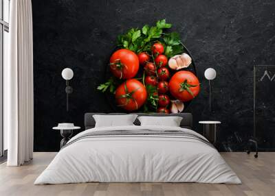 Fresh red tomatoes on a dark background. Vegetables. Top view. Free space for your text. Wall mural