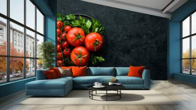 Fresh red tomatoes on a dark background. Vegetables. Top view. Free space for your text. Wall mural