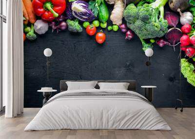 Fresh vegetables, chili, onion, garlic, herbs and spices.On a black wooden background. Free space for text . Top view Wall mural