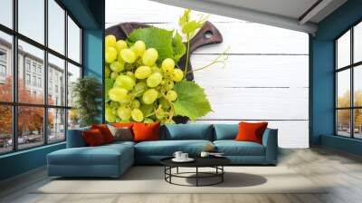 Grape. Fresh white grapes on a white wooden background. Top view. Free space for text. Wall mural