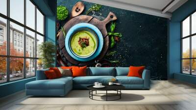 Green soup with bacon. Soup with broccoli, spinach and green peas. Top view. Rustic style. Wall mural