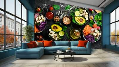 healthy vegetarian eating, super food. the concept of healthy eating. on a black stone background. t Wall mural