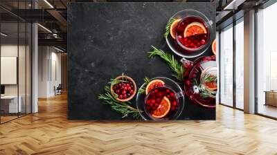 hot tea with berry cranberry and orange. on the black kitchen background. top view. free space for y Wall mural