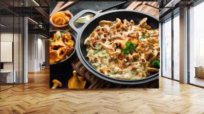 Mushroom dishes. Cooked chanterelle mushrooms in a cream sauce. Top view. Free space for text. Wall mural