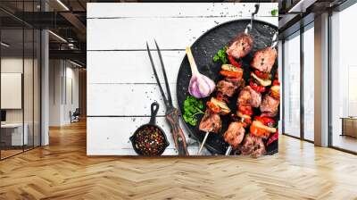 pork shish kebab with onions and tomatoes. barbecue. top view. free space for your text. rustic styl Wall mural