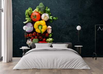 ripe vegetables. fresh vegetables on black stone background. tropical fruits. top view. free space f Wall mural