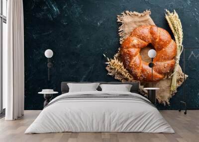 Round braided loaf of bread flour. Top view. Free space for your text. Wall mural